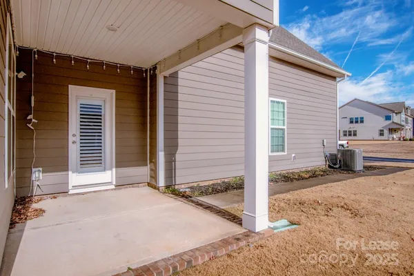 a view of a house with wooden fence