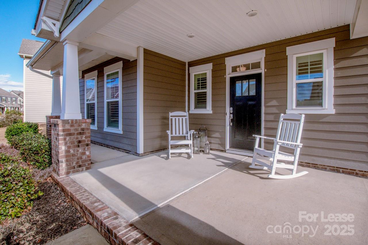 13218 Caite Ridge Road Davidson, NC 28036 - Photo 8 of 48 a backyard with table and chairs and potted plants
