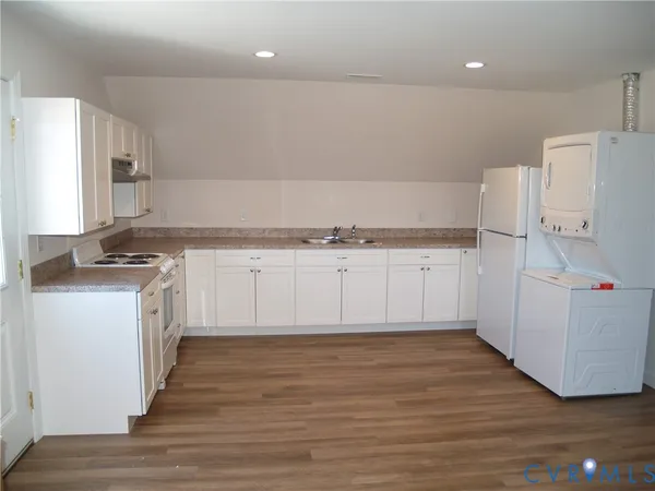 a view of a house with a snow in the yard