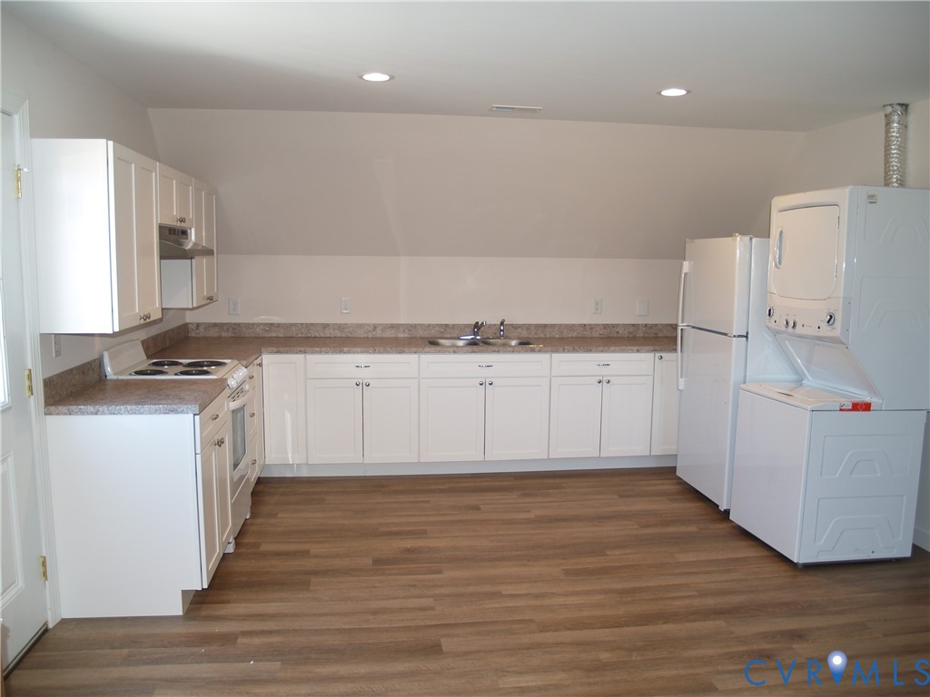 3129 Chickahominy Road Toano, VA 23168 - Photo 18 of 39 a kitchen with granite countertop a white stove top oven and white cabinets