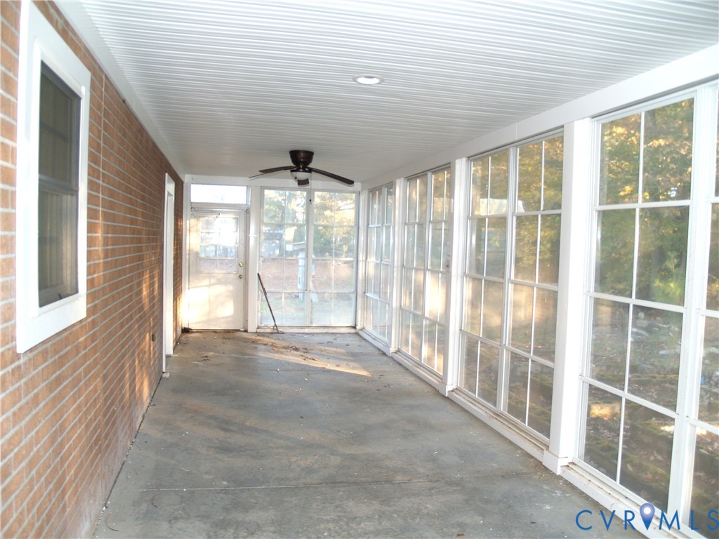 3129 Chickahominy Road Toano, VA 23168 - Photo 29 of 39 a view of an empty room with wooden floor and a window