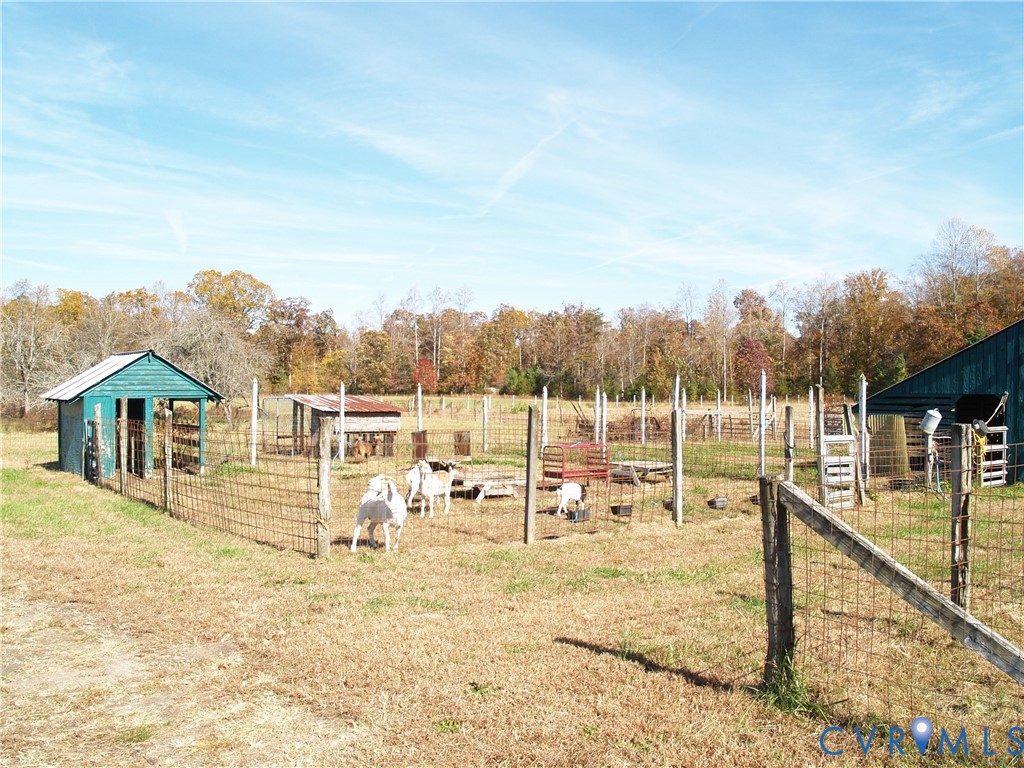 3129 Chickahominy Road Toano, VA 23168 - Photo 30 of 39 a view of a house with large trees and sitting area