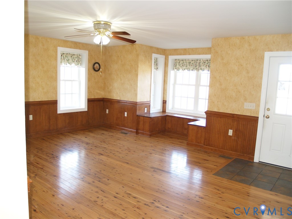 3129 Chickahominy Road Toano, VA 23168 - Photo 7 of 39 a view of empty room with wooden floor and fan