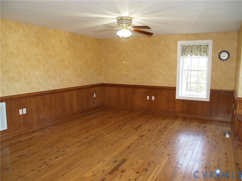 3129 Chickahominy Road Toano, VA 23168 - Photo 8 of 39 a view of an empty room with wooden floor and a window