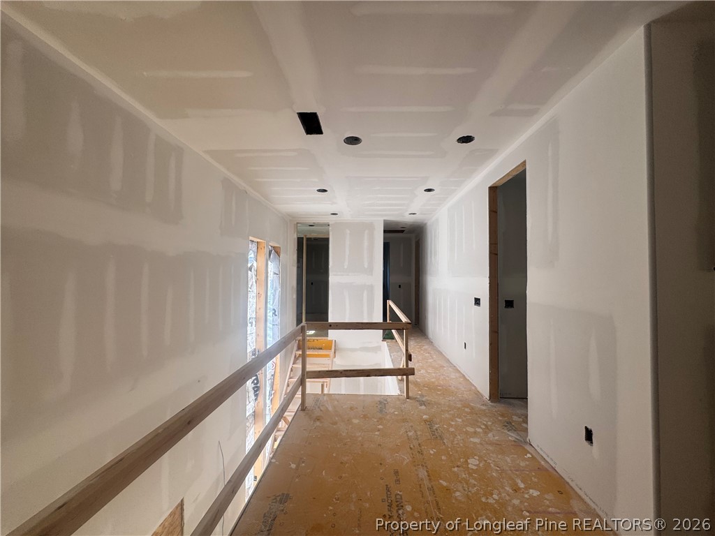 45 Beckett Ridge Pinehurst, NC 28374 - Photo 25 of 50 a view of a hallway with a large window and wooden floor