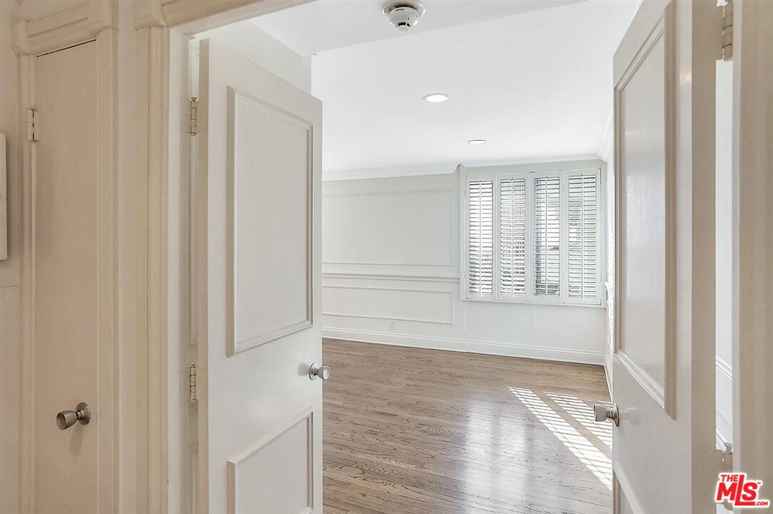 2160 Century Park East, Unit 1903 Los Angeles, CA 90067 - Photo 22 of 40 a view of empty room with wooden floor and fan