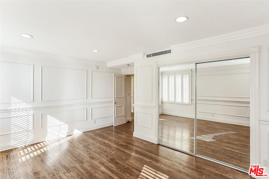 2160 Century Park East, Unit 1903 Los Angeles, CA 90067 - Photo 24 of 40 a view of empty room with wooden floor and cabinet