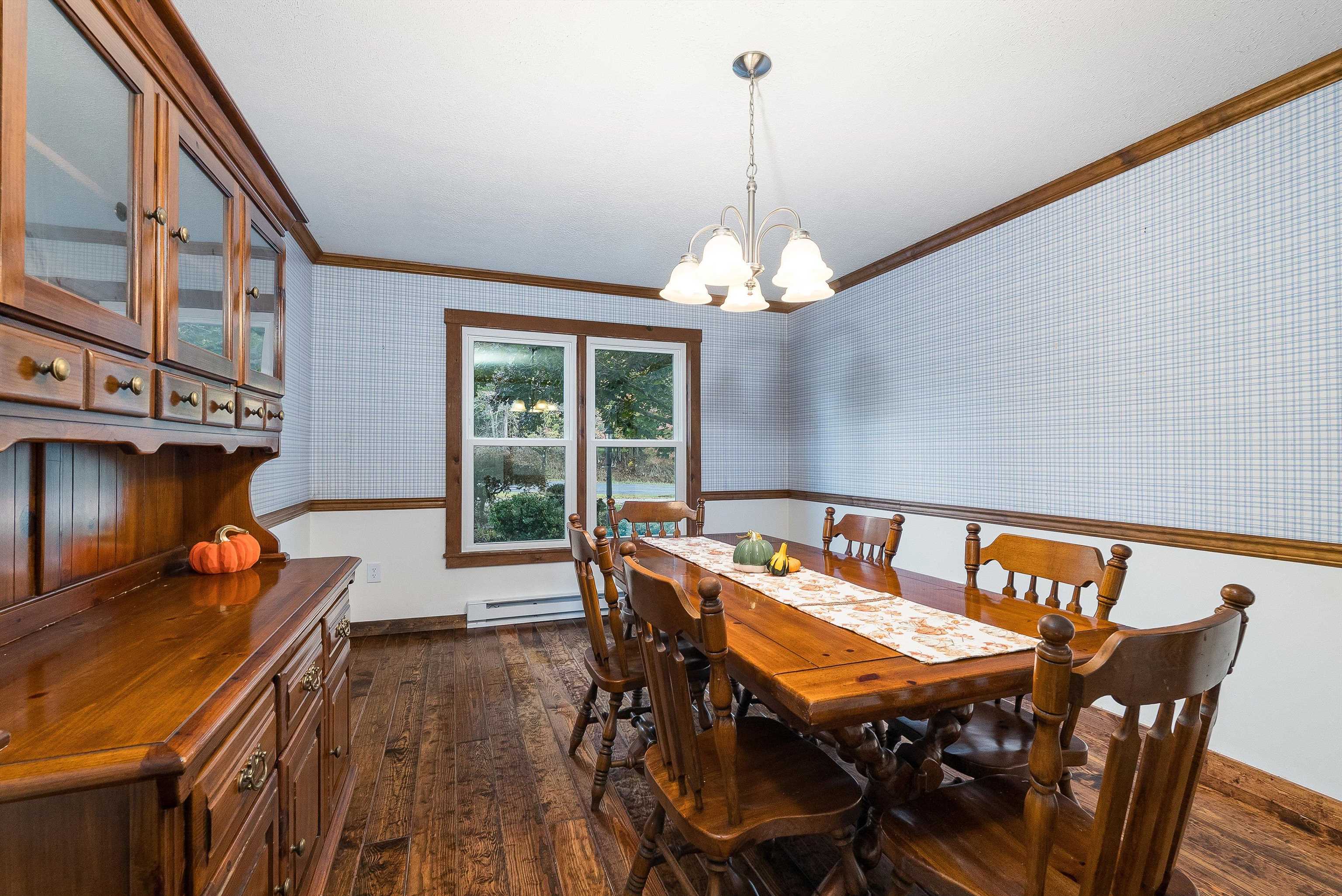 598 Broadhead School Road Greenville, VA 24440 - Photo 16 of 55 a view of a dining room with furniture wooden floor and chandelier