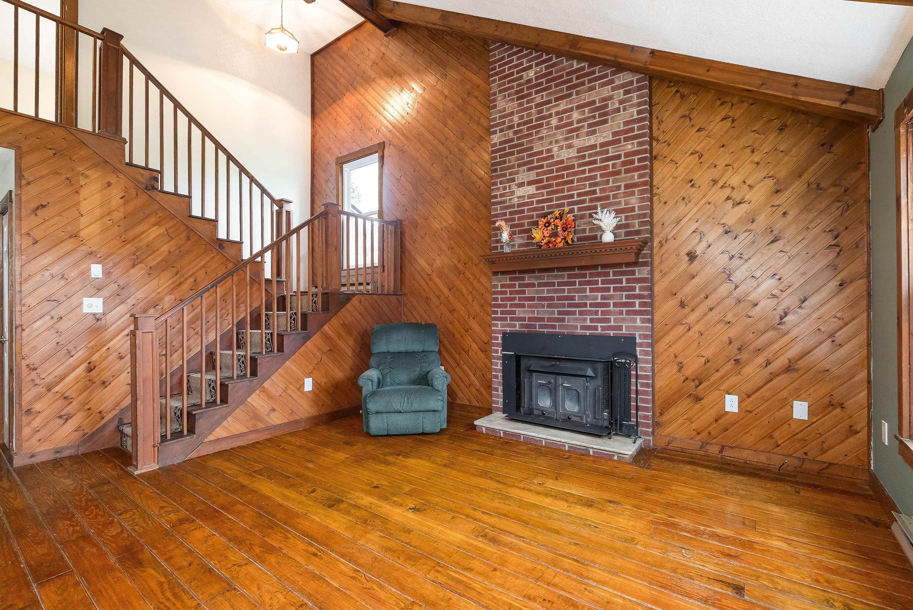 598 Broadhead School Road Greenville, VA 24440 - Photo 21 of 55 a view of an empty room with wooden floor fireplace and a window