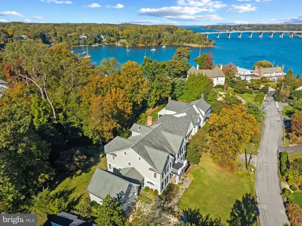 an aerial view of a house with a lake view