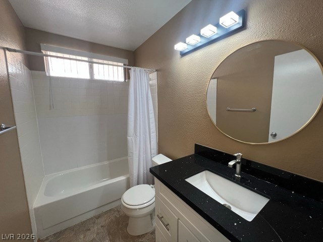 4140 North Compass Rose Way Las Vegas, NV 89108 - Photo 11 of 16 Bathroom with a textured wall, vanity, shower / tub combo with curtain, and a textured ceiling