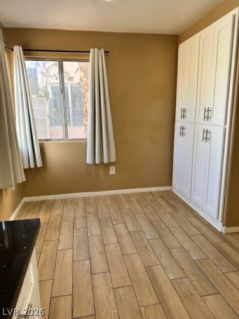 4140 North Compass Rose Way Las Vegas, NV 89108 - Photo 7 of 16 Unfurnished bedroom with wood finish floors and baseboards