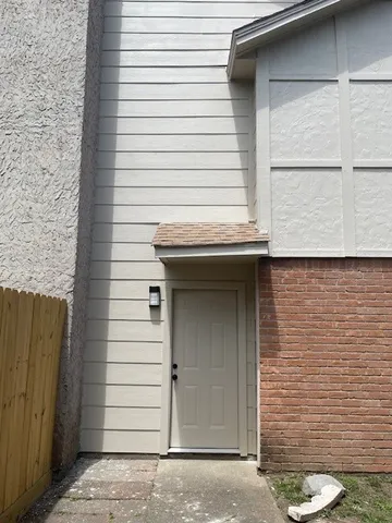 a view of a door and a window
