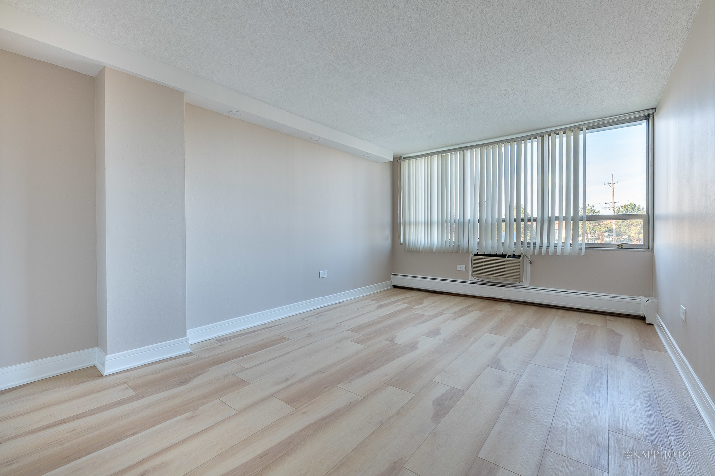 8801 West Golf Road, Unit 2I Niles, IL 60714 - Photo 15 of 29 a view of wooden floor and brick walls