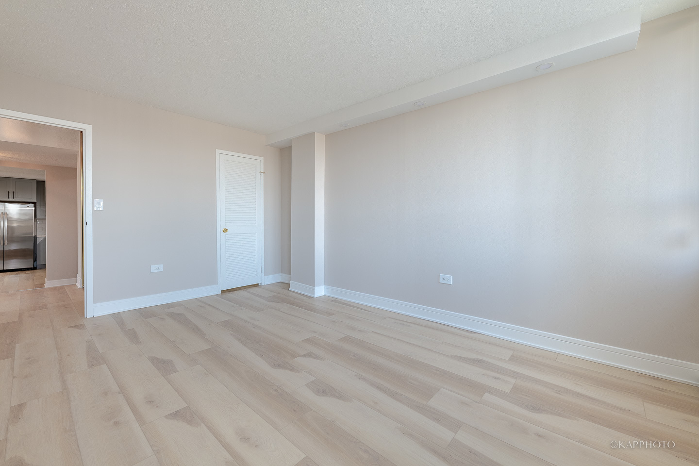 8801 West Golf Road, Unit 2I Niles, IL 60714 - Photo 16 of 29 a view of an empty room with wooden floor