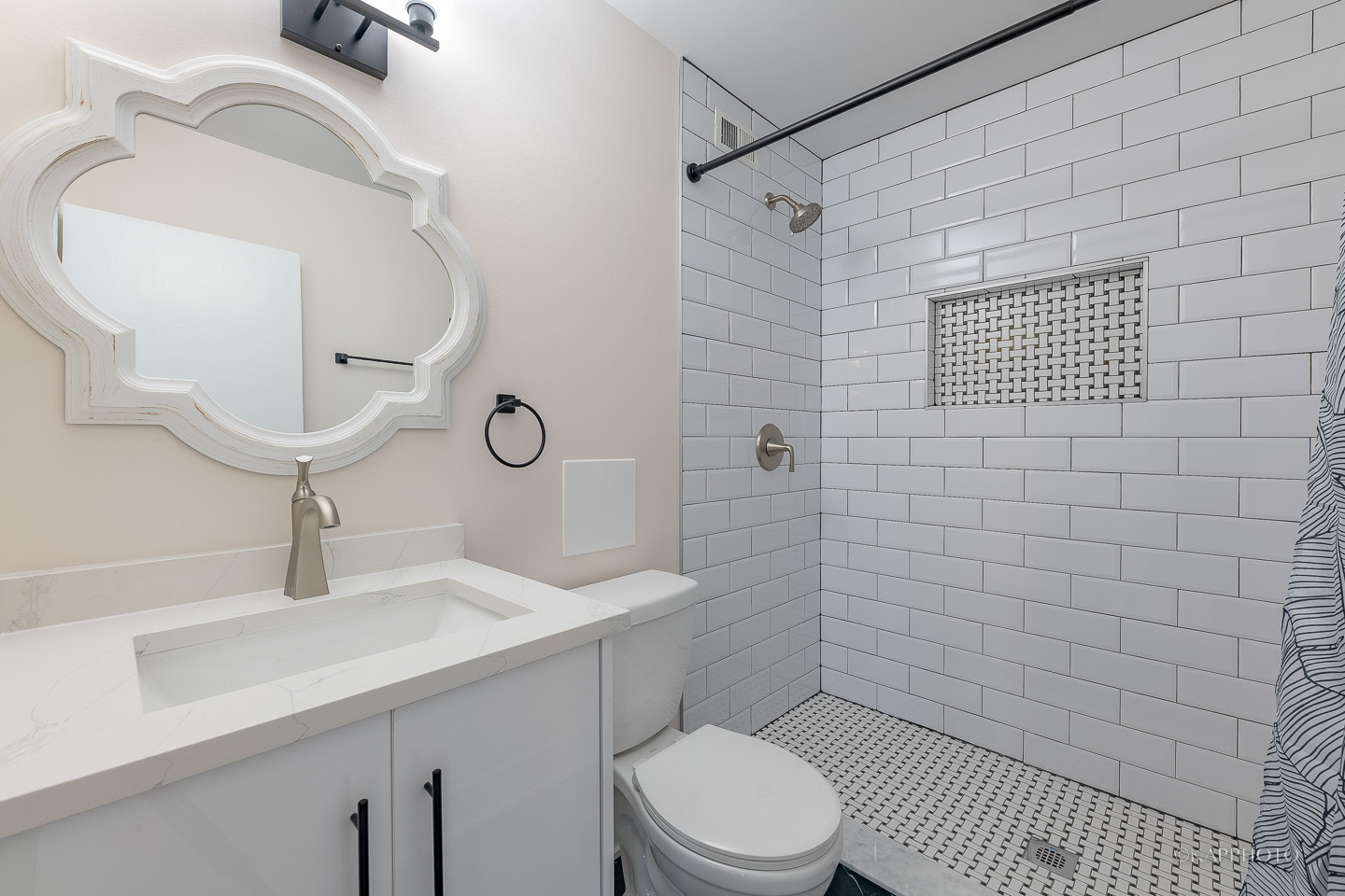 8801 West Golf Road, Unit 2I Niles, IL 60714 - Photo 20 of 29 a bathroom with a toilet a sink and mirror