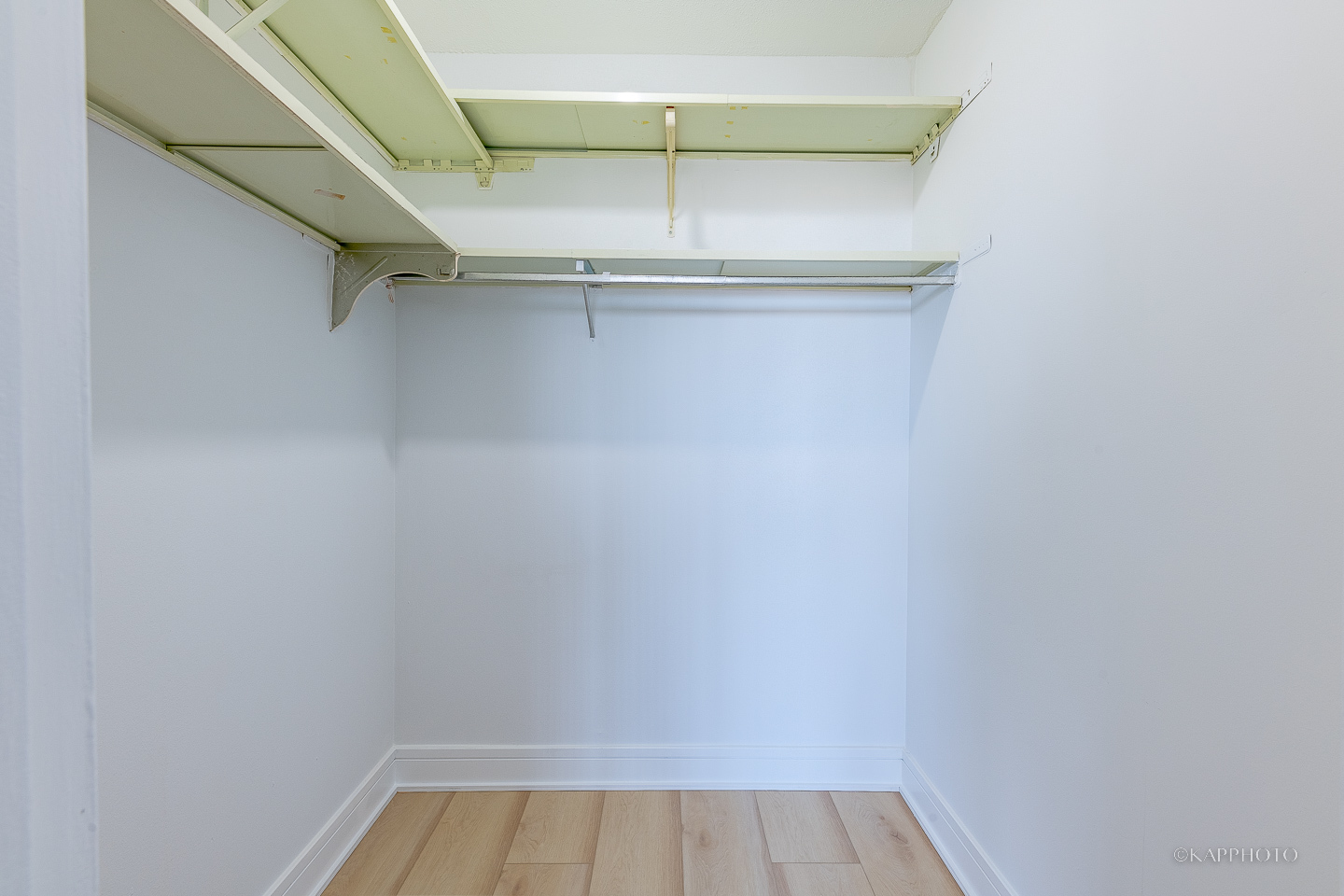 8801 West Golf Road, Unit 2I Niles, IL 60714 - Photo 22 of 29 a view of walk in closet with empty racks