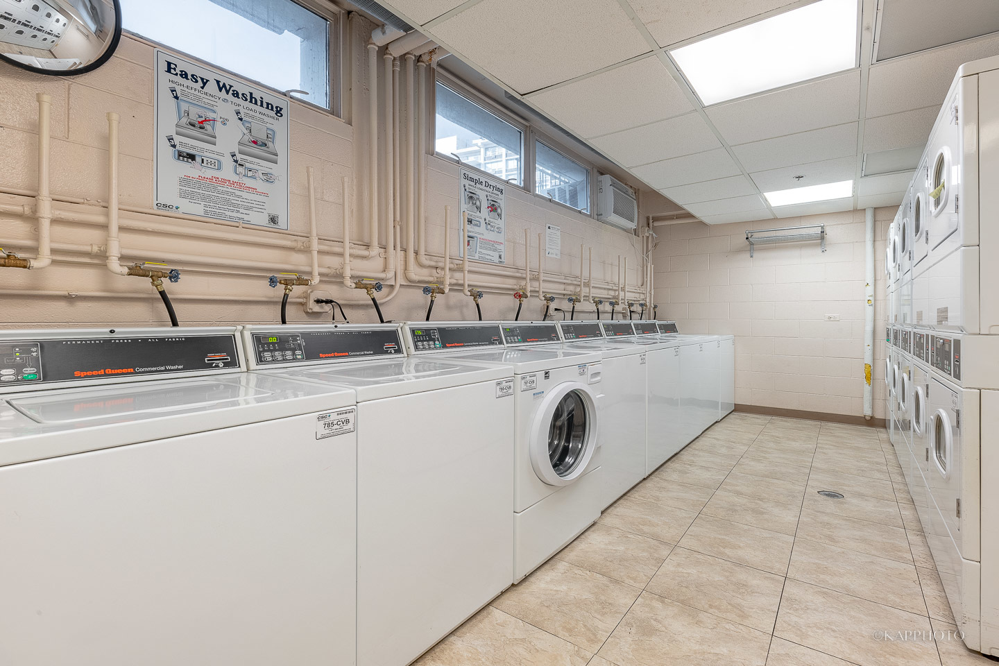 8801 West Golf Road, Unit 2I Niles, IL 60714 - Photo 27 of 29 a utility room with cabinets