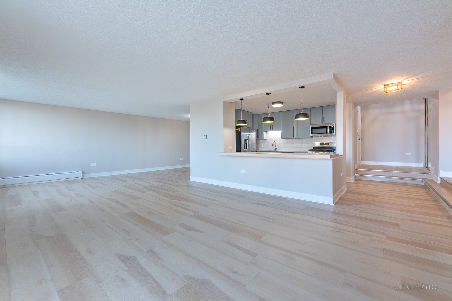 8801 West Golf Road, Unit 2I Niles, IL 60714 - Photo 4 of 29 a view of a kitchen and an empty room