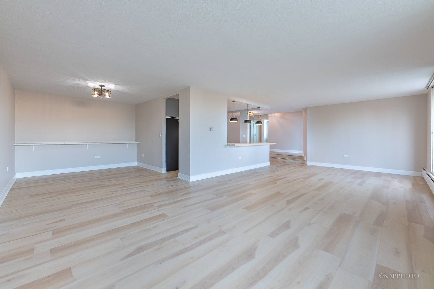 8801 West Golf Road, Unit 2I Niles, IL 60714 - Photo 5 of 29 a view of an empty room with wooden floor