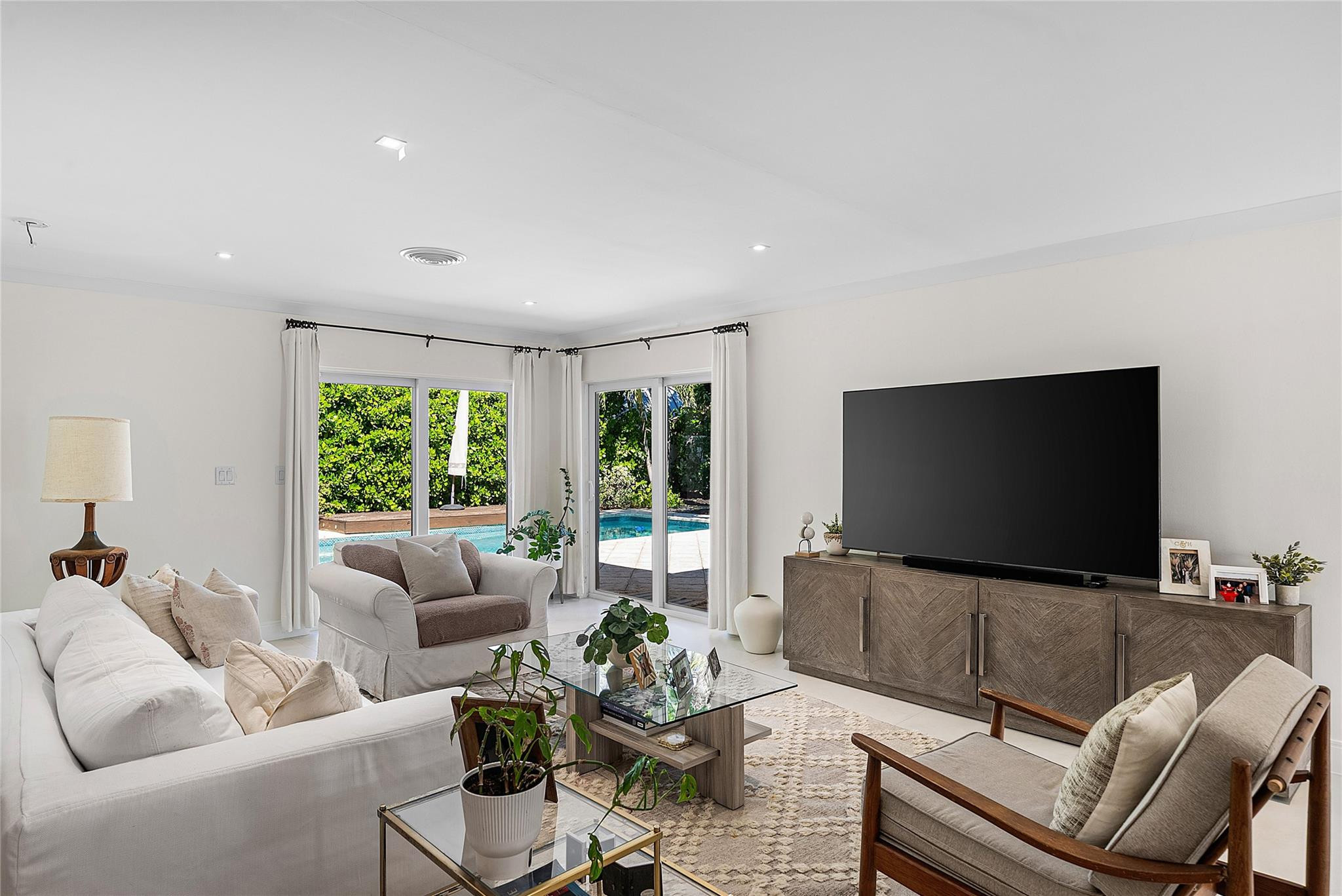 2233 Northeast 30th Court Lighthouse Point, FL 33064 - Photo 17 of 48 a living room with furniture and a flat screen tv