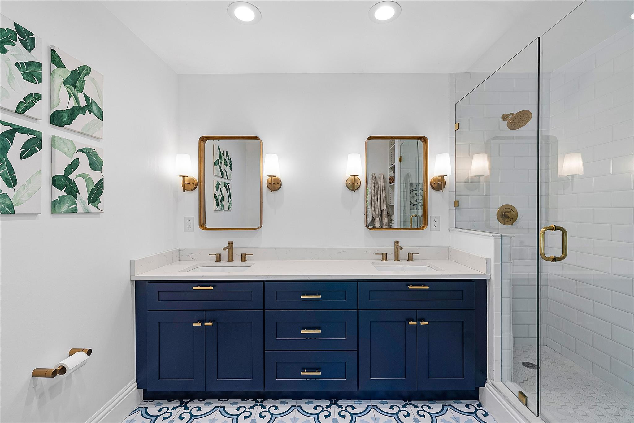 2233 Northeast 30th Court Lighthouse Point, FL 33064 - Photo 25 of 48 a bathroom with a double vanity sink and a mirror