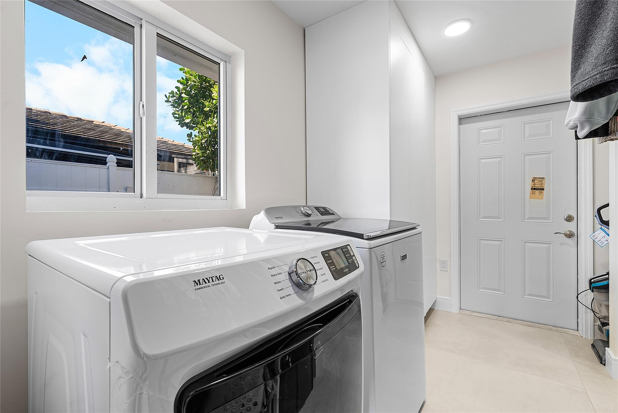 2233 Northeast 30th Court Lighthouse Point, FL 33064 - Photo 32 of 48 a utility room with washer and dryer
