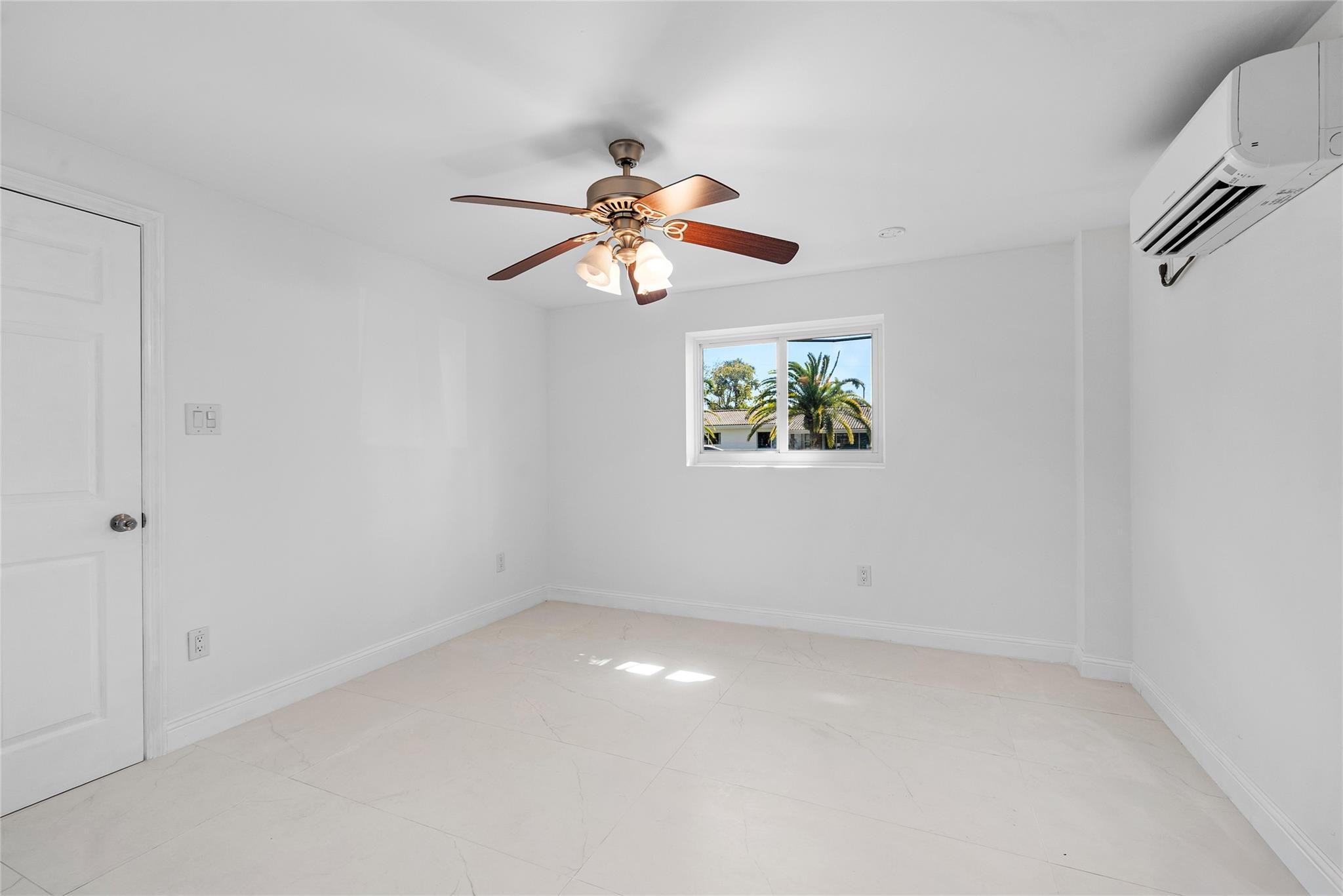 2233 Northeast 30th Court Lighthouse Point, FL 33064 - Photo 33 of 48 wooden floor in an empty room with a window