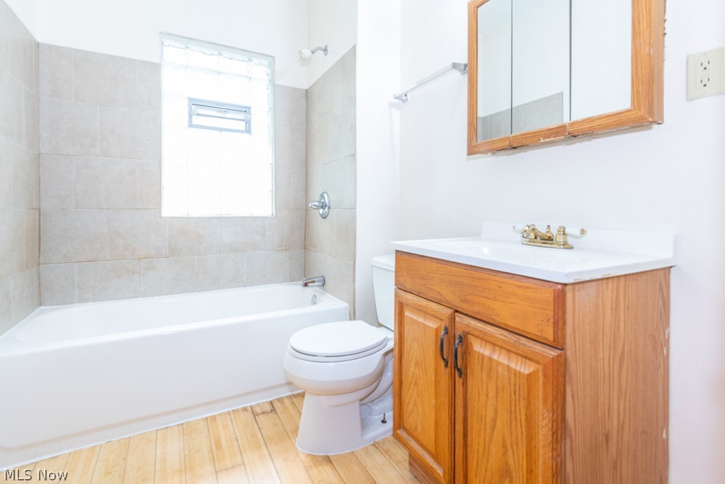 917 Helmsdale Road Cleveland Heights, OH 44112 - Photo 26 of 28 Full bath with vanity, shower / bathtub combination, and light wood-style floors