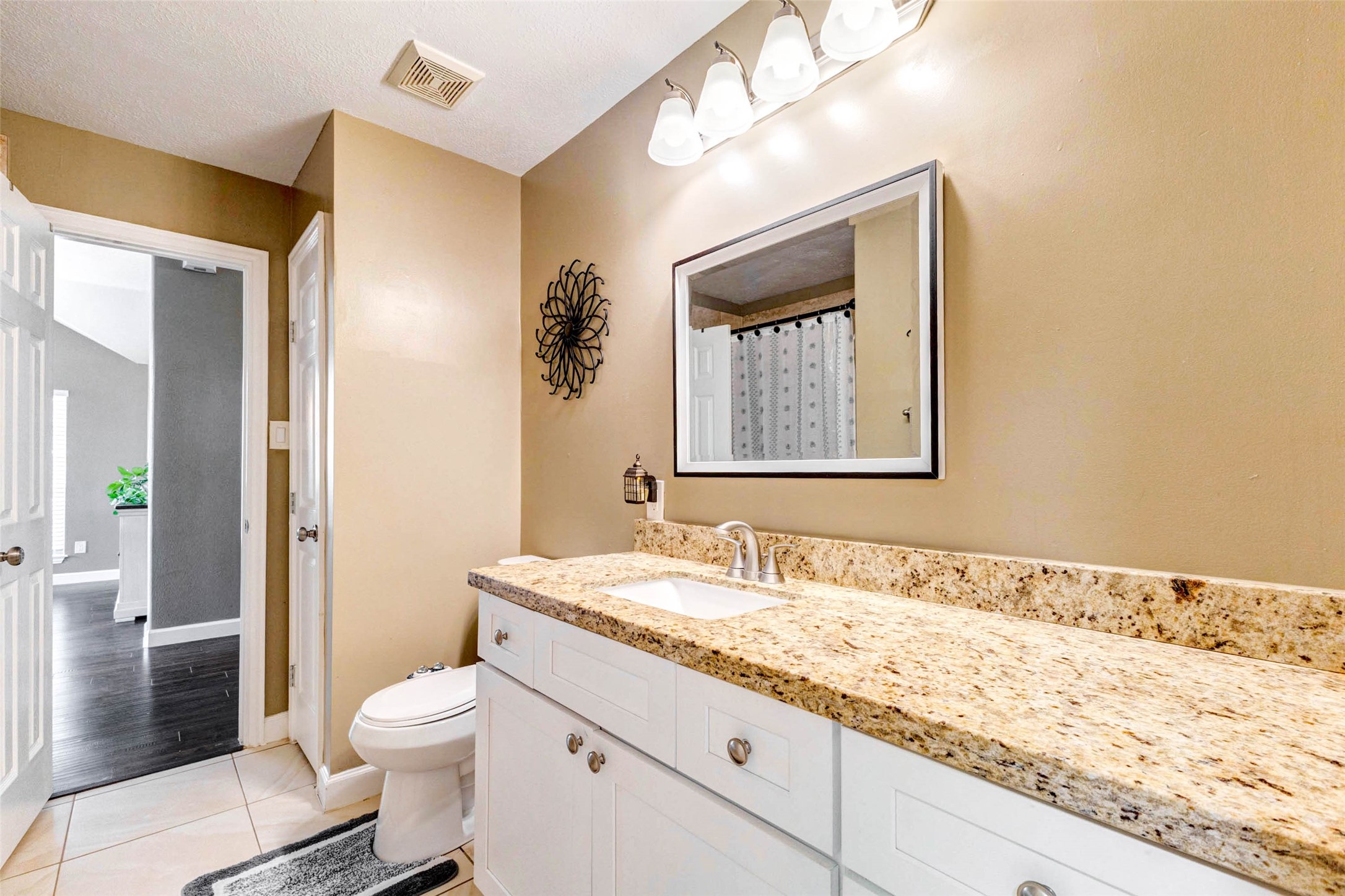 6334 Sampras Ace Court Spring, TX 77379 - Photo 27 of 48 One of 2 full baths. This one has a bidet attachment. It opens to the side that is easy access to the living/dining room and also opens to the hallway for the secondary bedrooms.