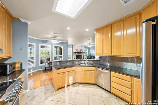 a bedroom with furniture and large windows