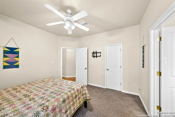 an aerial view of residential houses with outdoor space and swimming pool