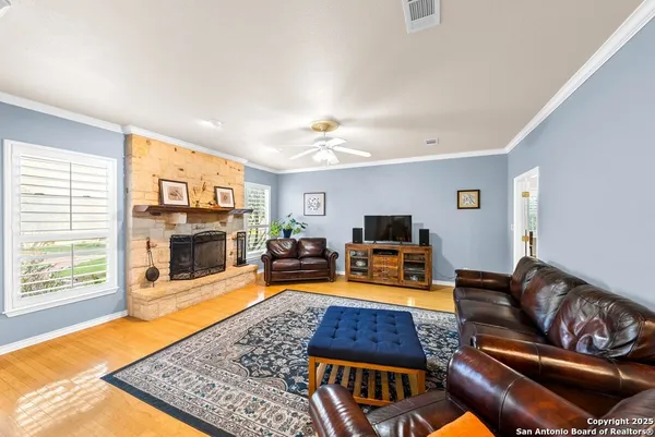 a living room with furniture and a rug