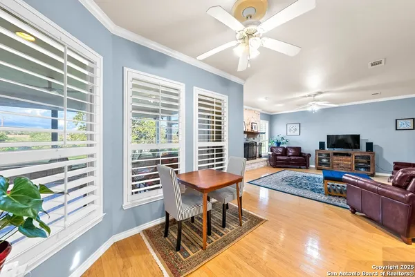 a spacious bathroom with a tub a sink and a large window