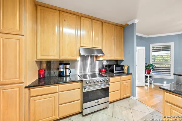 a living room with a piano and a table