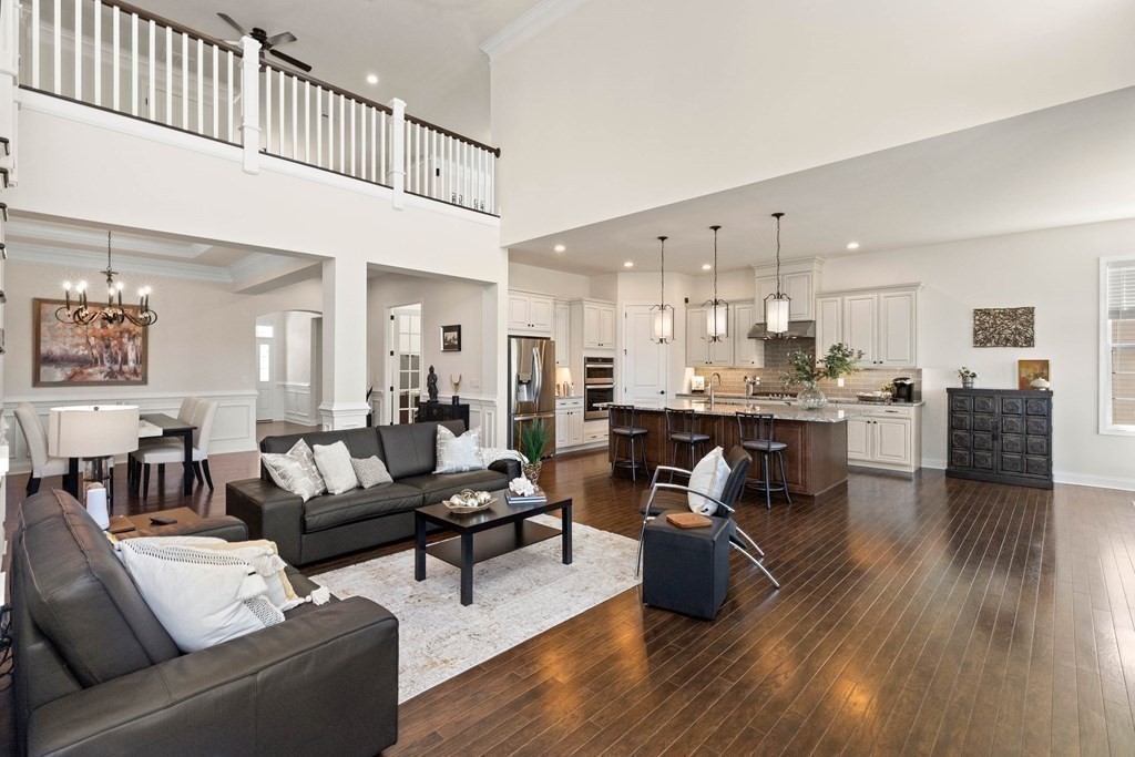 49 Pine Tree Drive, Unit 49 Methuen, MA 01844 - Photo 13 of 38 a living room with kitchen island furniture and a kitchen view