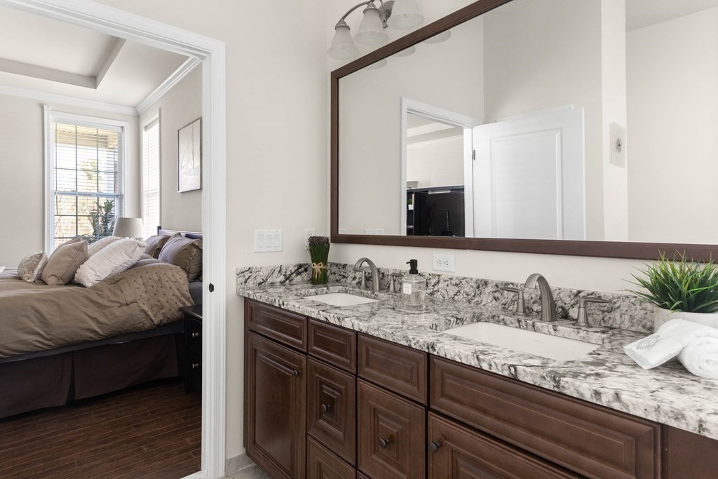 49 Pine Tree Drive, Unit 49 Methuen, MA 01844 - Photo 17 of 38 a en suite bathroom with a granite countertop double vanity sink and a mirror