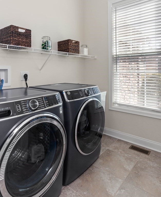 49 Pine Tree Drive, Unit 49 Methuen, MA 01844 - Photo 21 of 38 a utility room with dryer and washer
