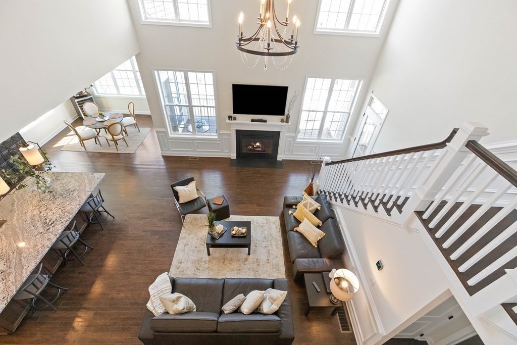 49 Pine Tree Drive, Unit 49 Methuen, MA 01844 - Photo 22 of 38 a living room with furniture and a flat screen tv