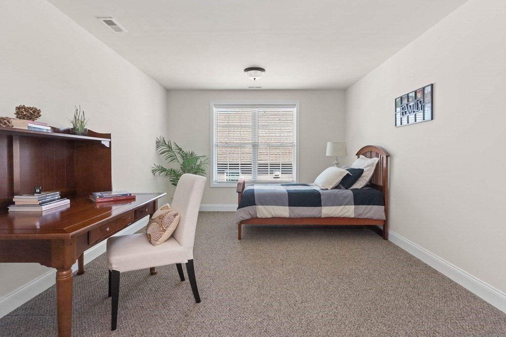 49 Pine Tree Drive, Unit 49 Methuen, MA 01844 - Photo 23 of 38 a living room with furniture and a window