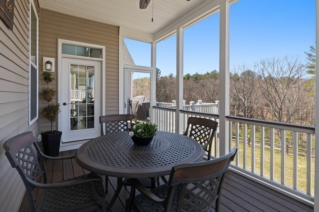 49 Pine Tree Drive, Unit 49 Methuen, MA 01844 - Photo 27 of 38 a view of a house with a table and chairs