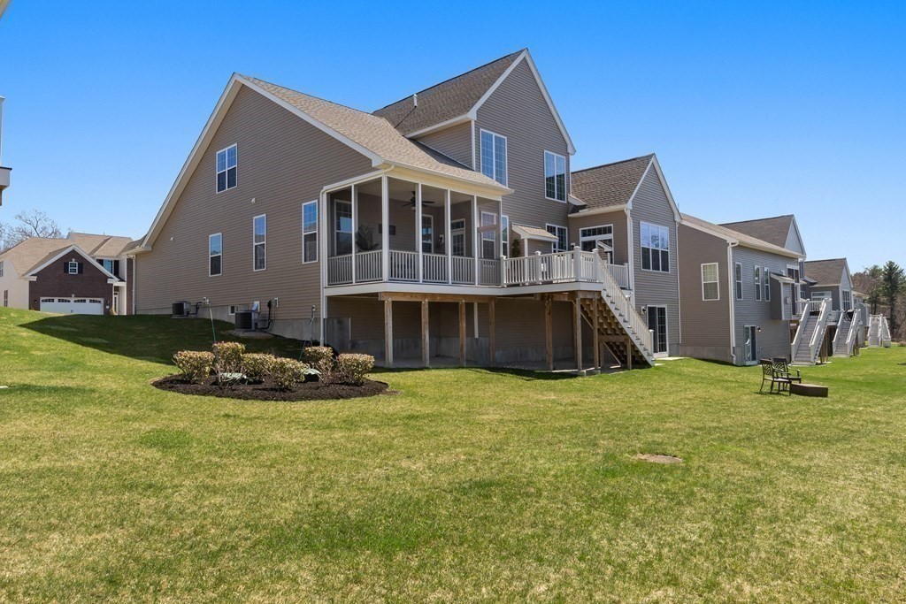49 Pine Tree Drive, Unit 49 Methuen, MA 01844 - Photo 29 of 38 a front view of a house with a yard