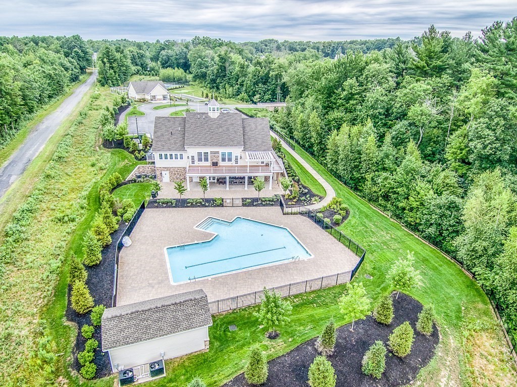 49 Pine Tree Drive, Unit 49 Methuen, MA 01844 - Photo 31 of 38 a view of a house with a yard