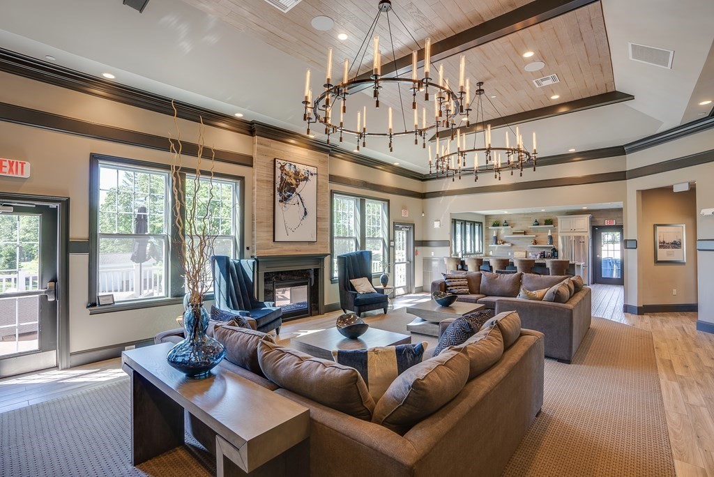 49 Pine Tree Drive, Unit 49 Methuen, MA 01844 - Photo 32 of 38 a living room with fireplace furniture and a large window