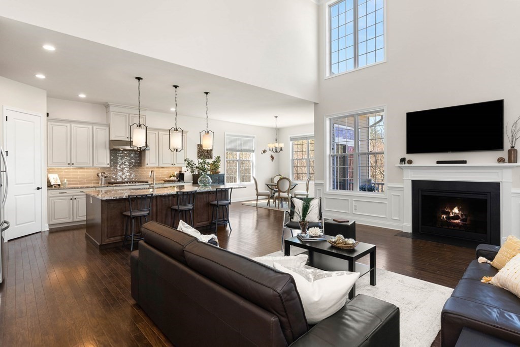 49 Pine Tree Drive, Unit 49 Methuen, MA 01844 - Photo 5 of 38 a living room with fireplace furniture and a flat screen tv