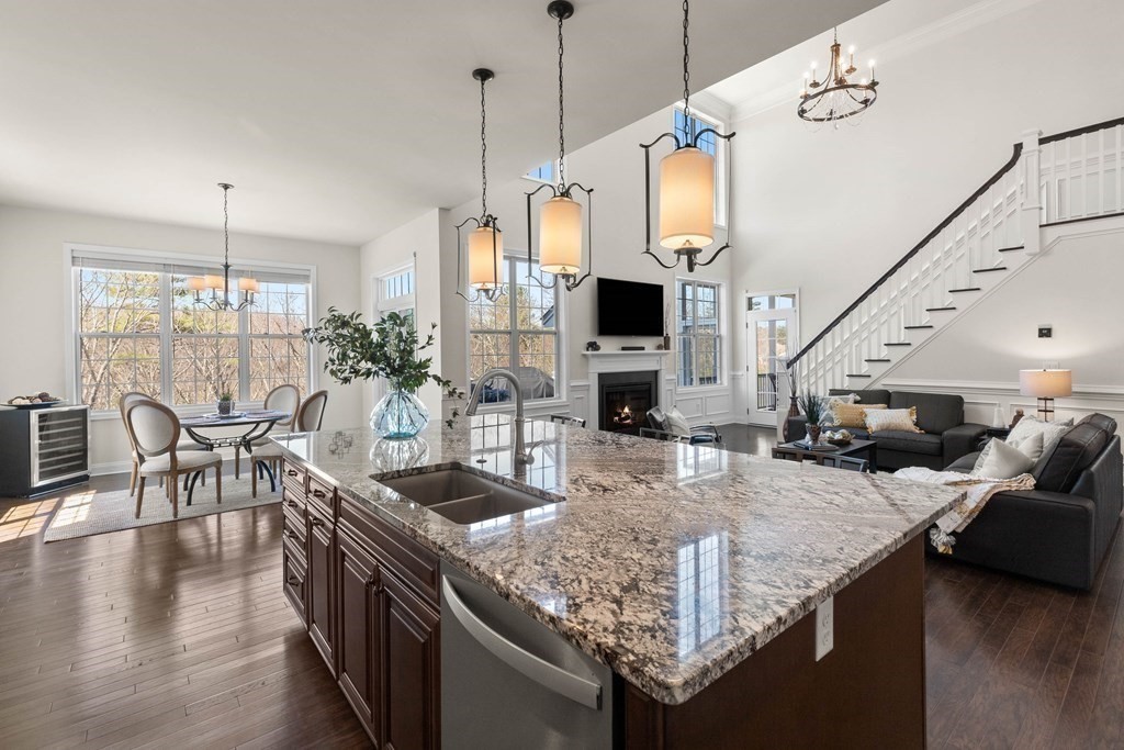 49 Pine Tree Drive, Unit 49 Methuen, MA 01844 - Photo 8 of 38 a kitchen with sink and living room
