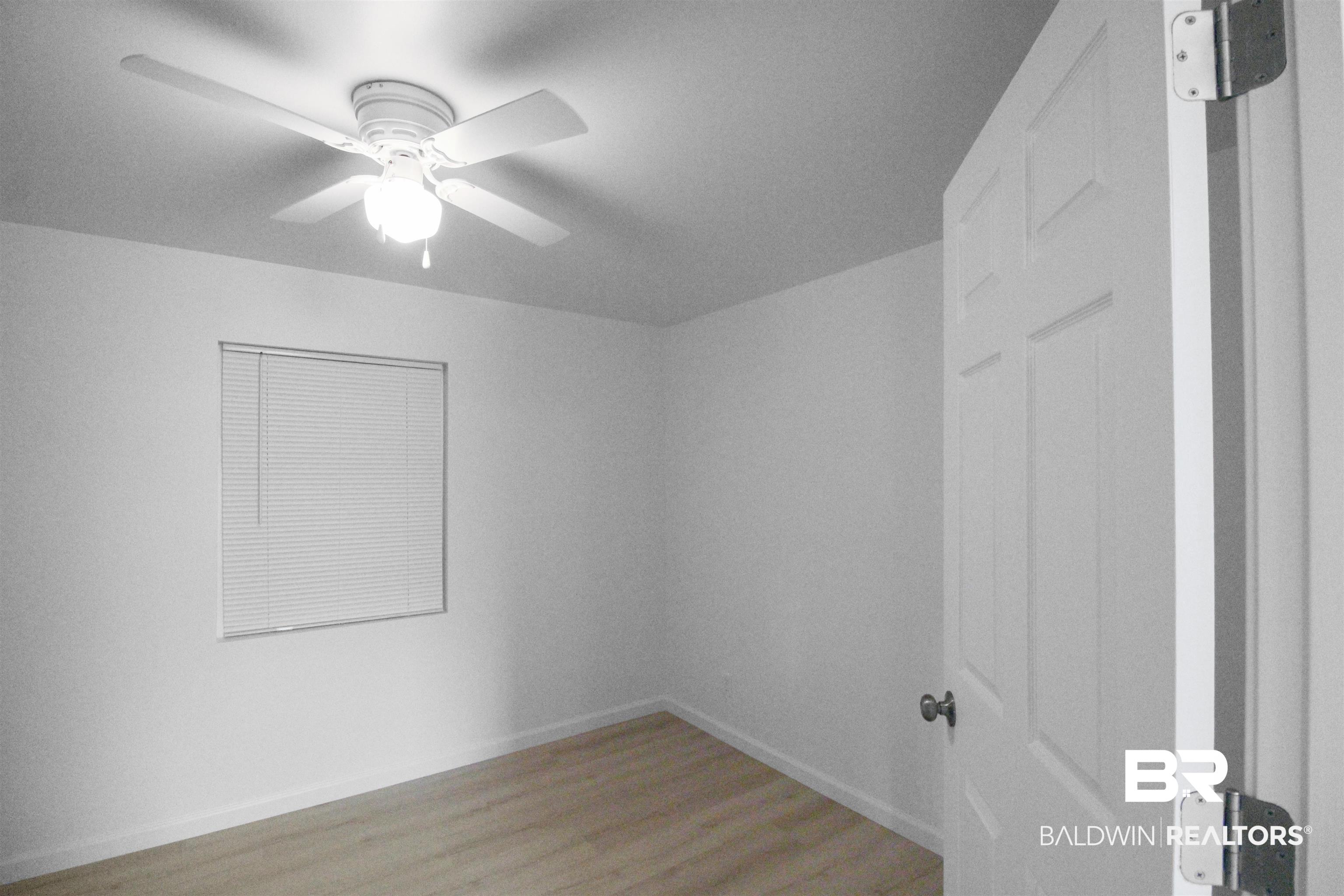 17622 Brewer Road Foley, AL 36535 - Photo 6 of 26 Spare room with a ceiling fan and light wood finished floors