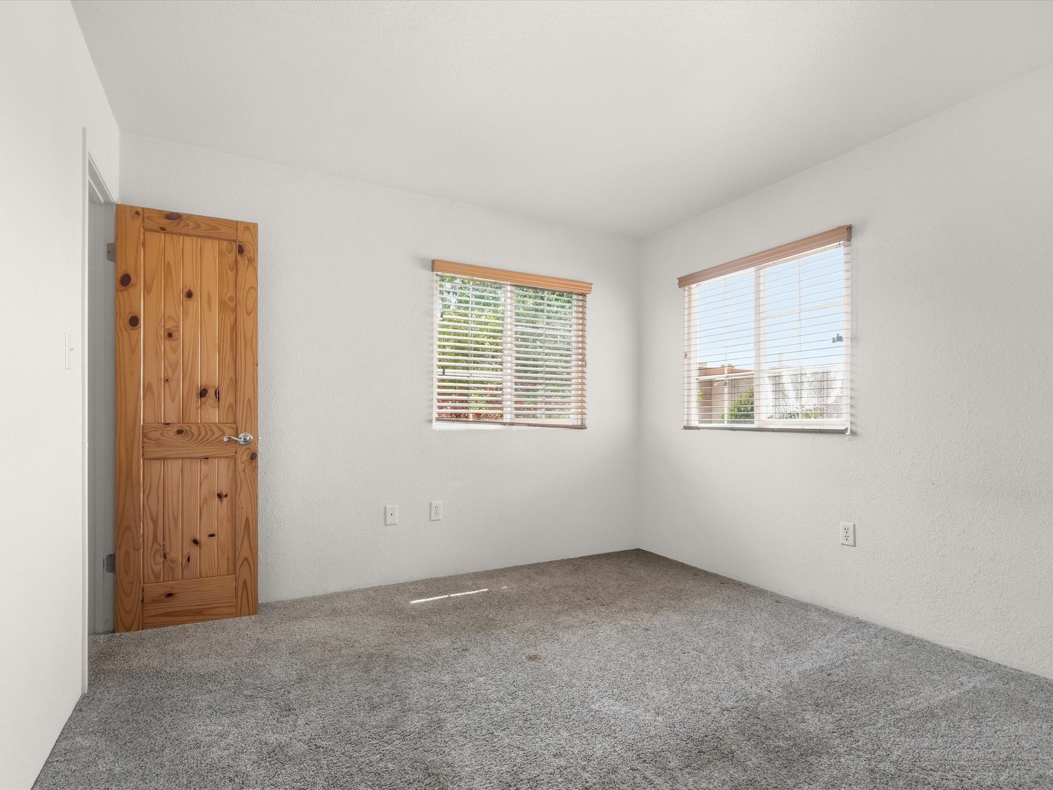 2210 Miguel Chavez Road, Unit 411 Santa Fe, NM 87505 - Photo 21 of 59 The primary bedroom with walk in closet and attached bathroom