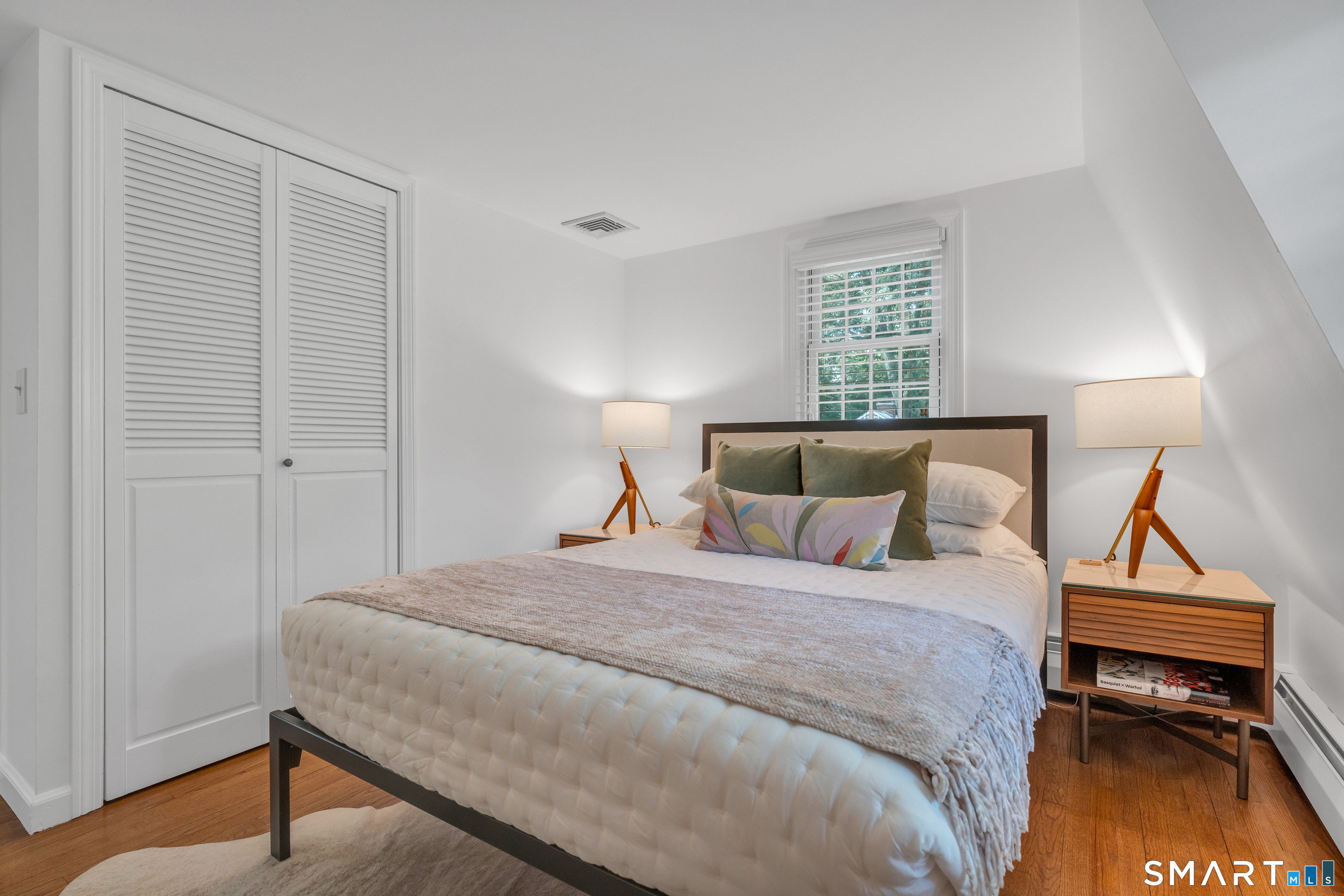 33 River Edge Farms Road Madison, CT 06443 - Photo 27 of 40 A bright and inviting bedroom offering comfort, versatility, and timeless style.