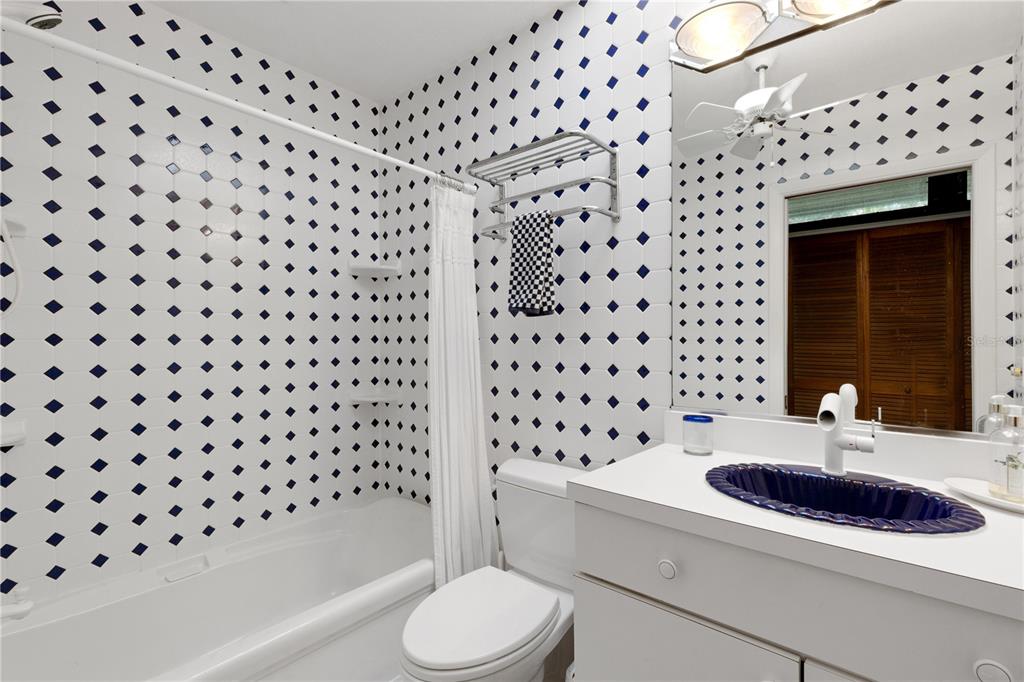 62 Sandy Hook Road South Sarasota, FL 34242 - Photo 16 of 66 a bathroom with a sink a toilet and shower